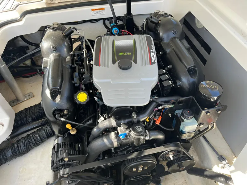 Slide: The Image of Engine compartment of a 2015 Monterey M4 boat, featuring a powerful 350 engine. - 38