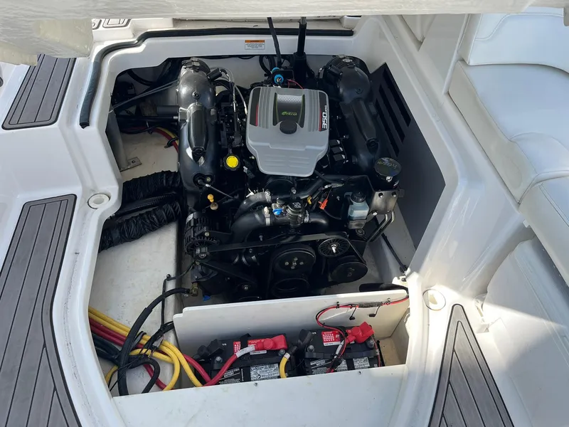 Slide: The Image of Engine compartment of a 2015 Monterey M4 boat, showcasing the engine and battery setup. - 39
