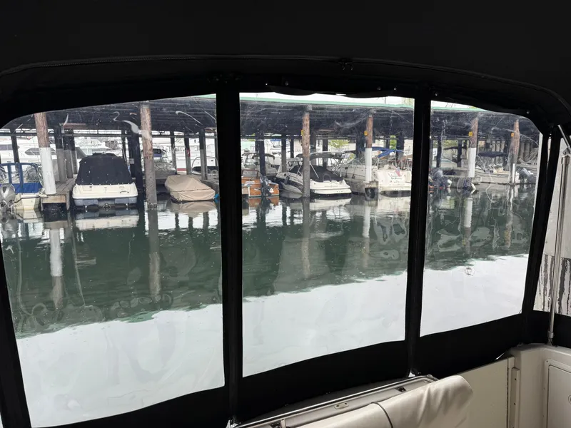 Slide: The Image of View from a 2003 Monterey 302 Cruiser, overlooking a marina with docked boats. - 16