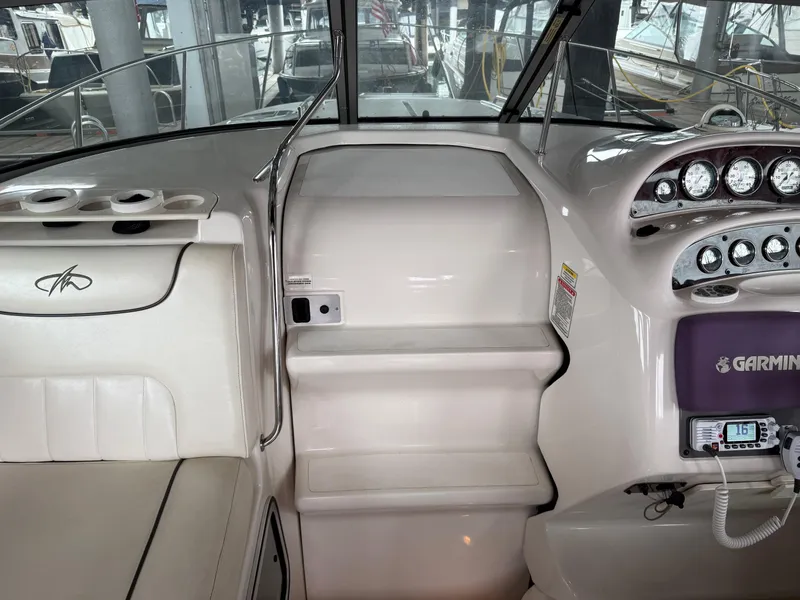 Slide: The Image of 2003 Monterey 302 Cruiser helm with Garmin navigation and white seating. - 17