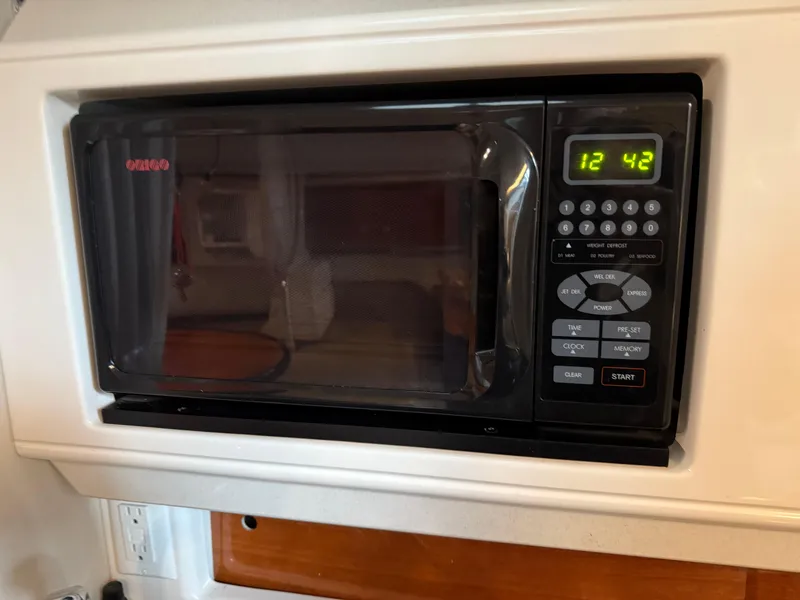 Slide: The Image of Built-in microwave in 2003 Monterey 302 Cruiser boat kitchen. - 29