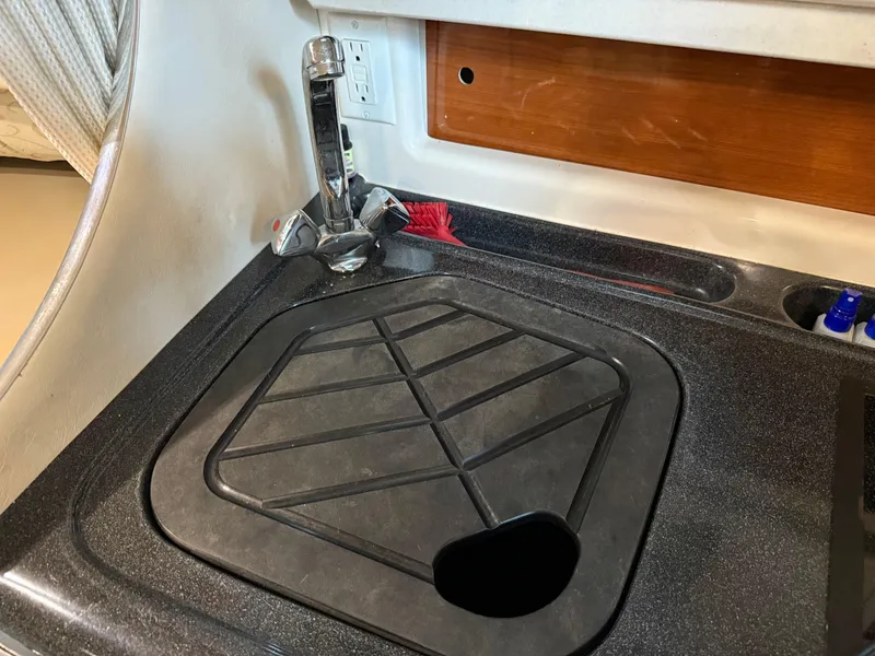 Slide: The Image of 2003 Monterey 302 Cruiser kitchen sink with faucet and countertop. - 31