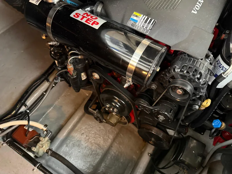 Slide: The Image of Engine compartment of a 2003 Monterey 302 Cruiser with visible "No Step" label. - 42