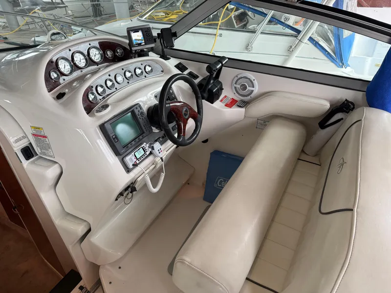 Slide: The Image of 2003 Monterey 302 Cruiser cockpit with steering wheel, gauges, and navigation equipment. - 5