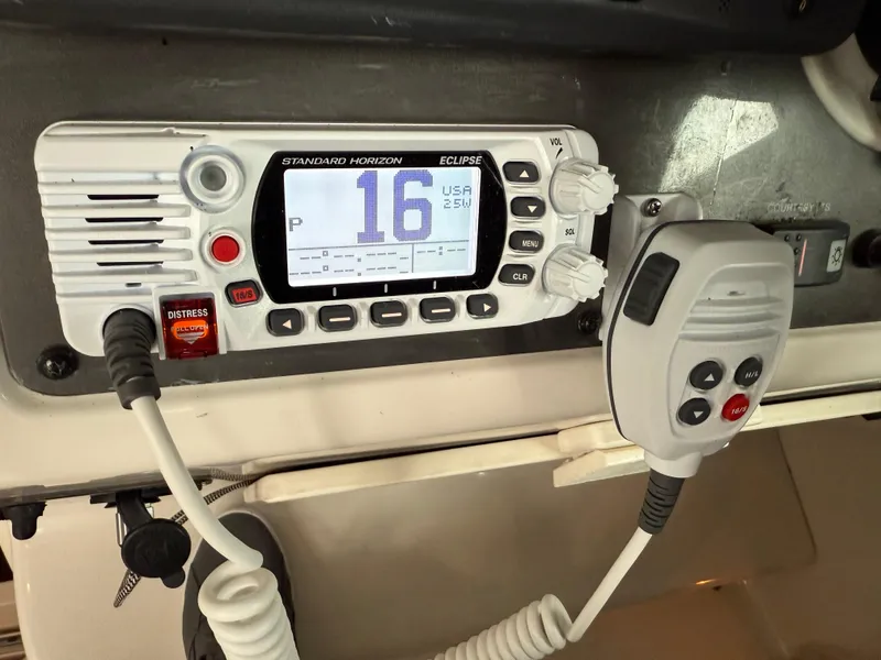 Slide: The Image of VHF radio system on a 2003 Monterey 302 Cruiser boat dashboard. - 8