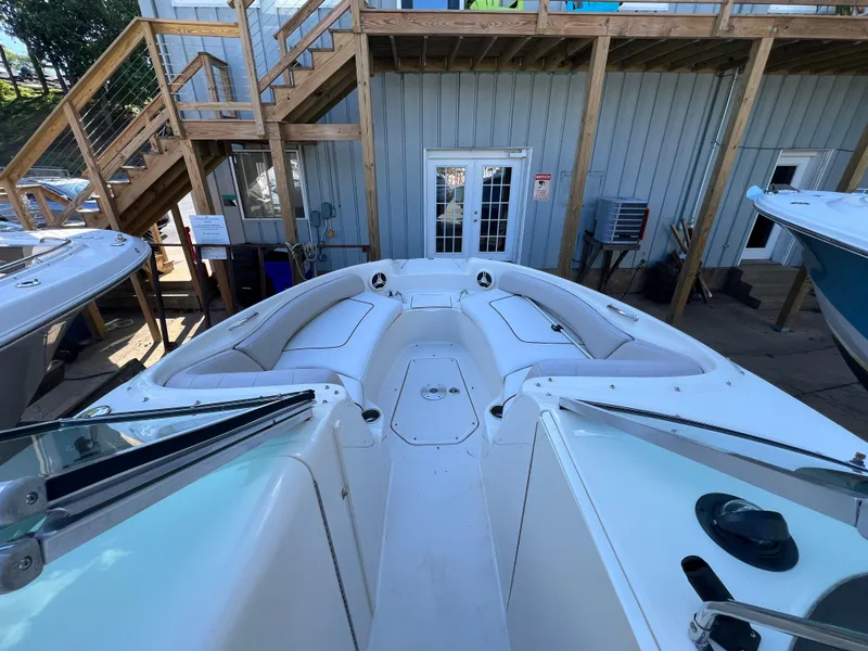 Slide: The Image of 2009 Sea Ray 240 Sundeck boat interior with spacious seating and modern design. - 2