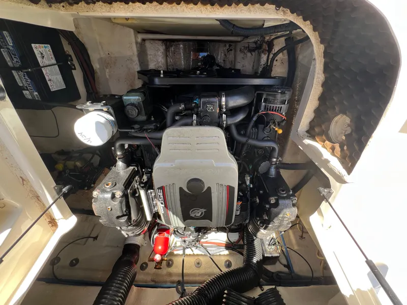 Slide: The Image of Engine compartment of a 2009 Sea Ray 240 Sundeck boat, showcasing mechanical components. - 8