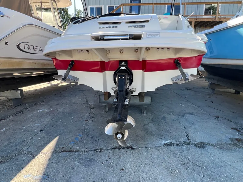 Slide: The Image of 2009 Sea Ray 240 Sundeck boat, rear view, on dry dock. - 9