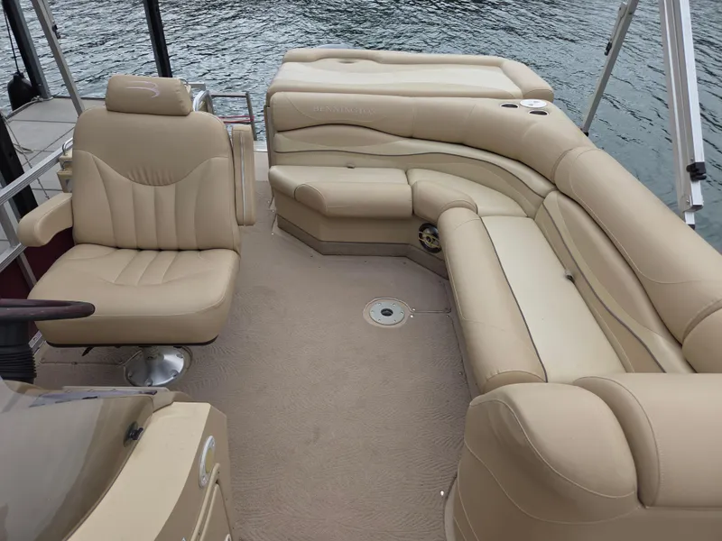Slide: The Image of 2009 Bennington 2577RFSi pontoon boat with beige seating on calm water. - 8