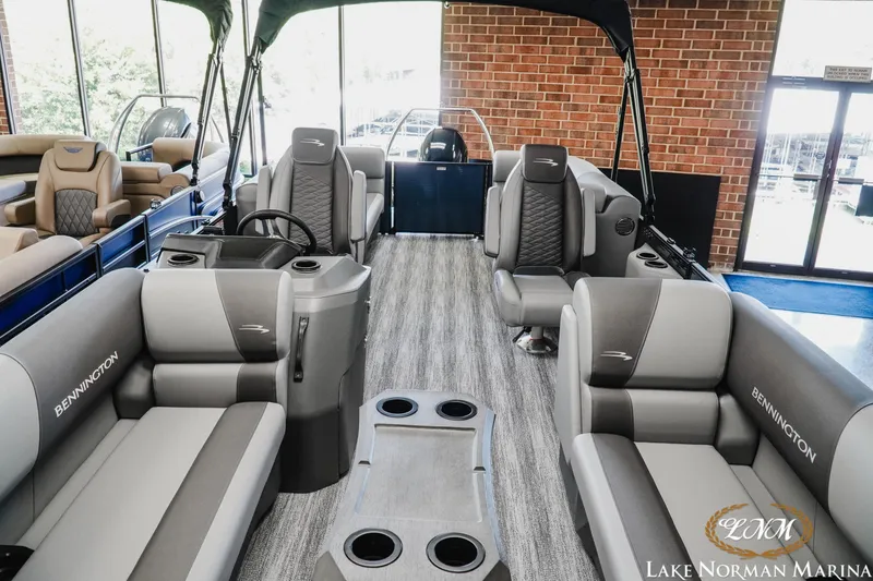 Slide: The Image of 2025 Bennington 23SSR pontoon boat interior with luxurious seating at Lake Norman Marina. - 12