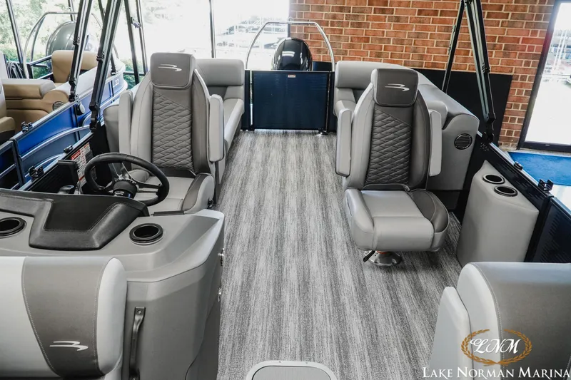 Slide: The Image of Interior of 2025 Bennington 23SSR pontoon boat with modern seating and steering console. - 14