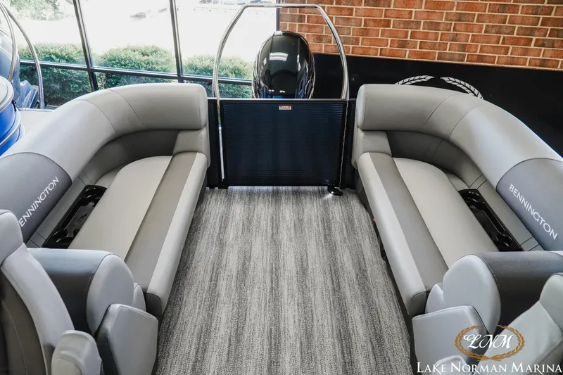 Slide: The Image of 2025 Bennington 23SSR pontoon boat interior with gray seating at Lake Norman Marina. - 15