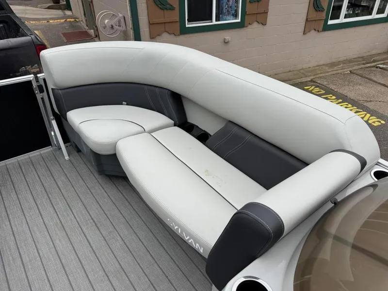 Slide: The Image of 2024 Sylvan Mirage 822 LZ boat seating with gray and white upholstery. - 11