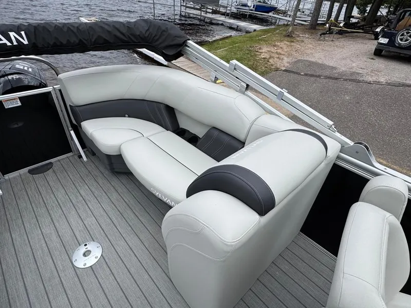 Slide: The Image of 2024 Sylvan Mirage 822 LZ pontoon boat with luxurious seating by the lake. - 16