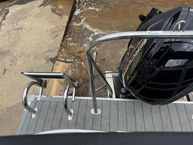 Slide: The Image of 2024 Sylvan Mirage 822 LZ boat with Mercury outboard motor and swim ladder. - 20