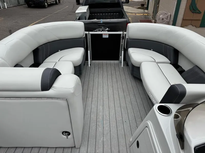 Slide: The Image of 2024 Sylvan Mirage 822 LZ pontoon boat interior with plush seating and modern design. - 7