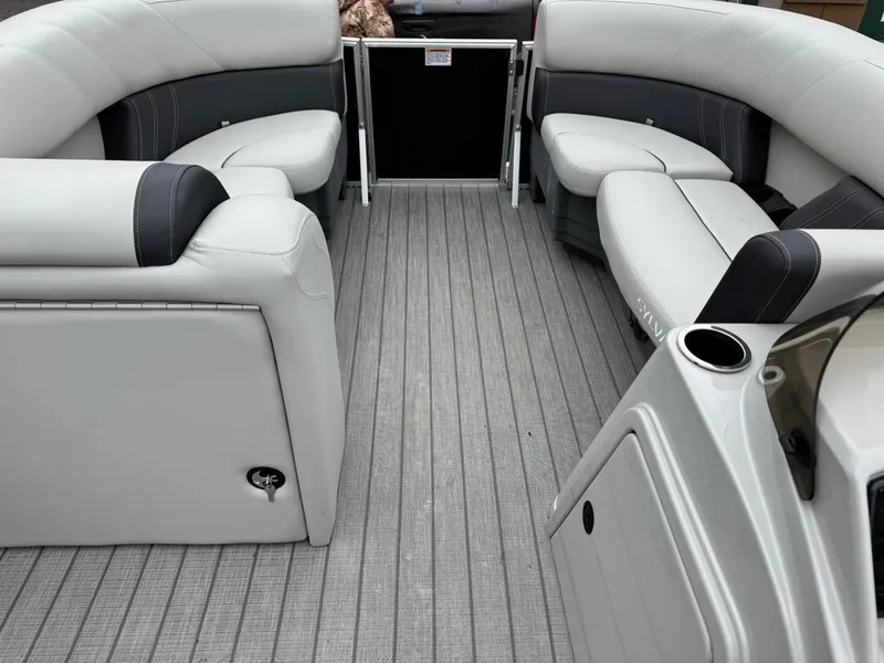 Slide: The Image of 2024 Sylvan Mirage 822 LZ pontoon boat interior with gray seating and flooring. - 8