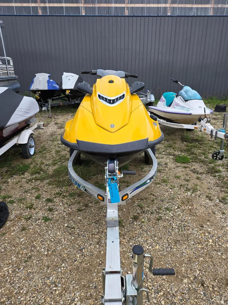 Slide: The Image of Yellow 2013 Yamaha VX1800 jet ski on trailer, parked outdoors. - 3