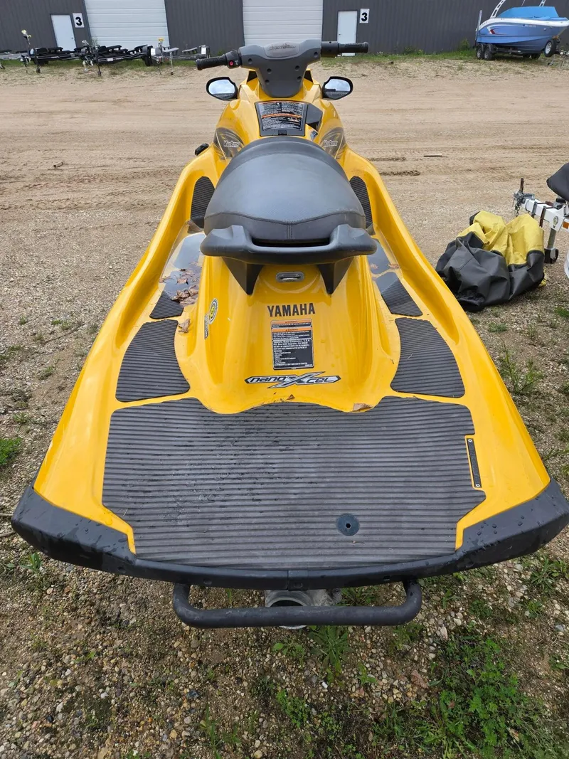 Slide: The Image of Yellow 2013 Yamaha Boats VX1800 jet ski parked on gravel surface. - 5