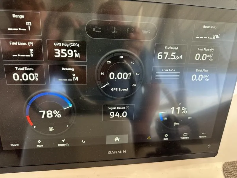 Slide: The Image of Garmin display on 2024 Grady-White Freedom 335 showing fuel, GPS, and engine data. - 13