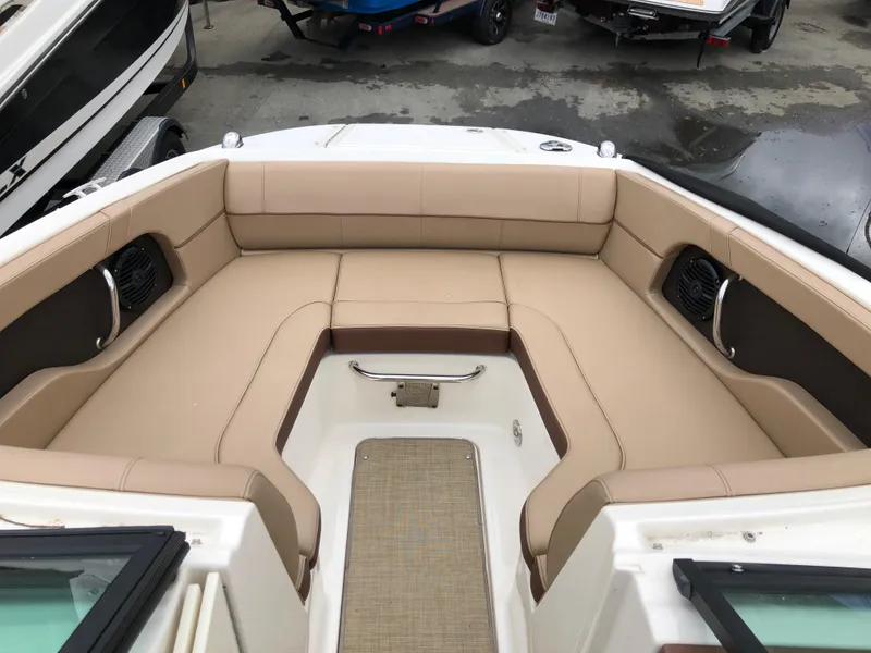 Slide: The Image of 2017 Sea Ray SDX 220 boat interior with beige seating and spacious layout. - 6