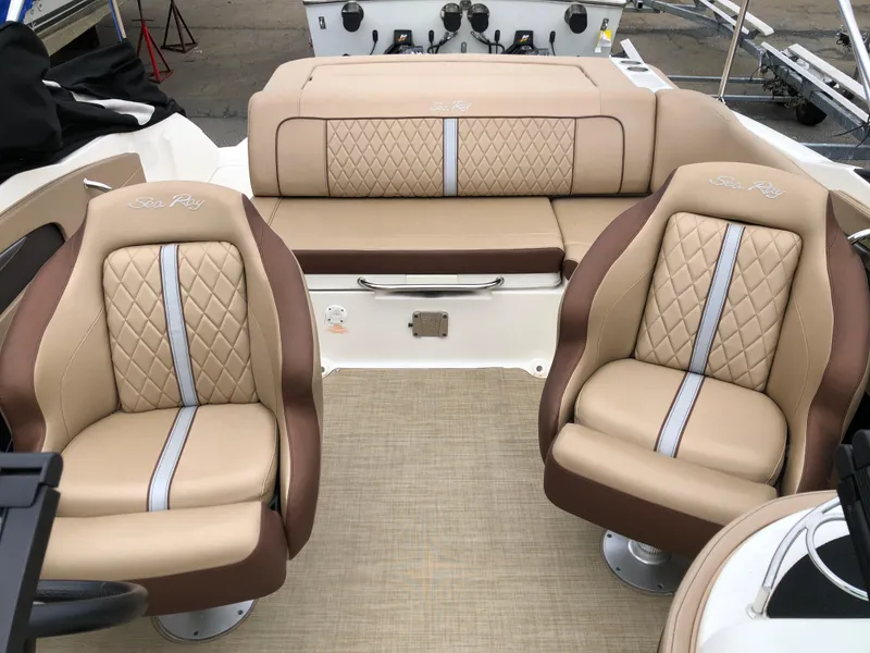 Slide: The Image of 2017 Sea Ray SDX 220 boat interior with beige and brown seating. - 7