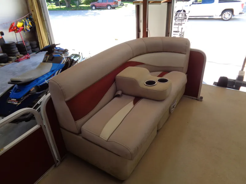 Slide: The Image of Sweetwater 2086 boat seating, beige and red upholstery, with cup holders, 2015 model. - 15