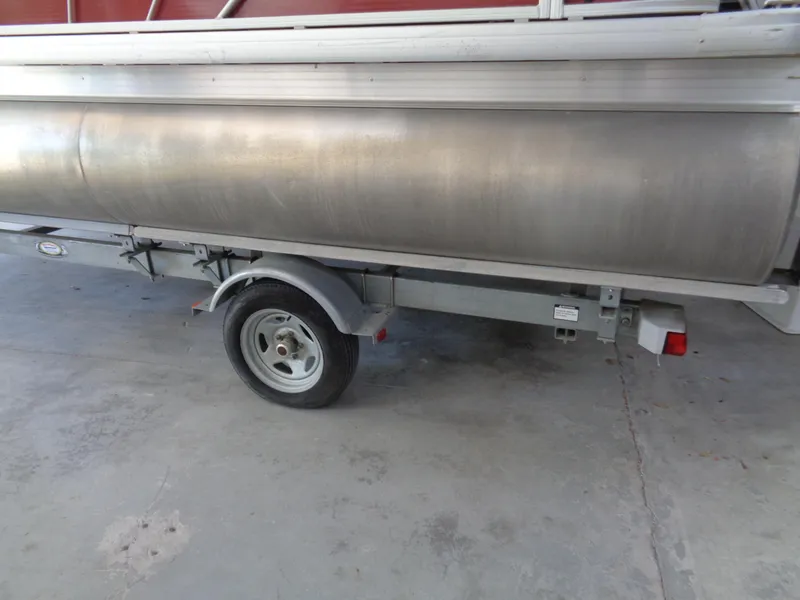 Slide: The Image of 2015 Sweetwater 2086 pontoon boat on a trailer, side view. - 5