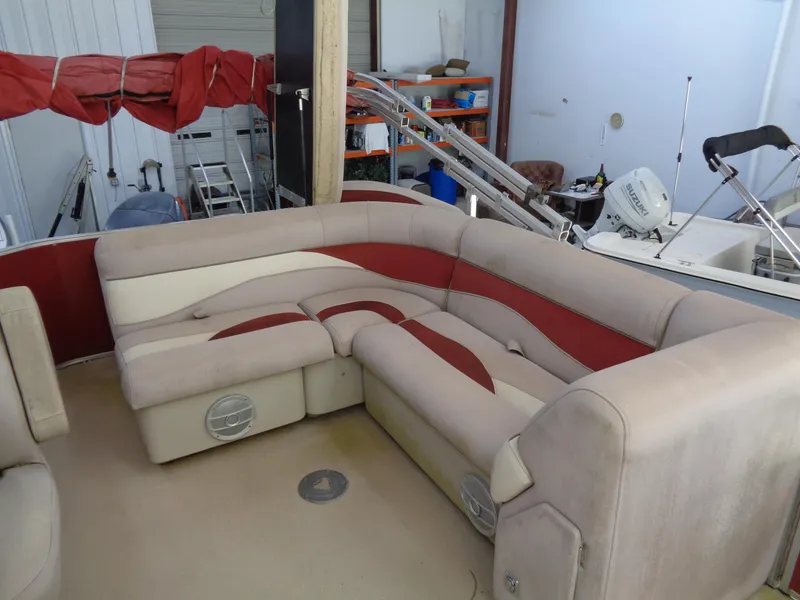 Slide: The Image of Sweetwater 2086 boat interior with beige and red seating, 2015 model. - 9