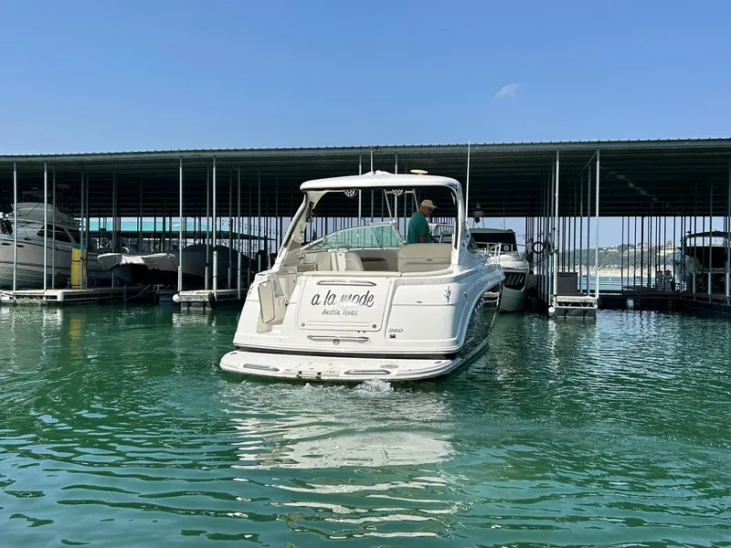 Slide: The Image of 2009 Chaparral 350 Signature boat docked in marina under clear blue sky. - 12