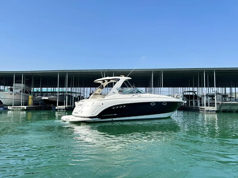 Slide: The Image of 2009 Chaparral 350 Signature boat docked in marina under clear blue sky. - 14