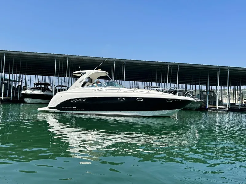 Slide: The Image of 2009 Chaparral 350 Signature yacht docked in marina, calm water, clear sky. - 16