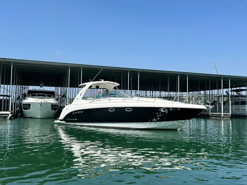 Slide: The Image of 2009 Chaparral 350 Signature yacht docked in marina under clear blue sky. - 18