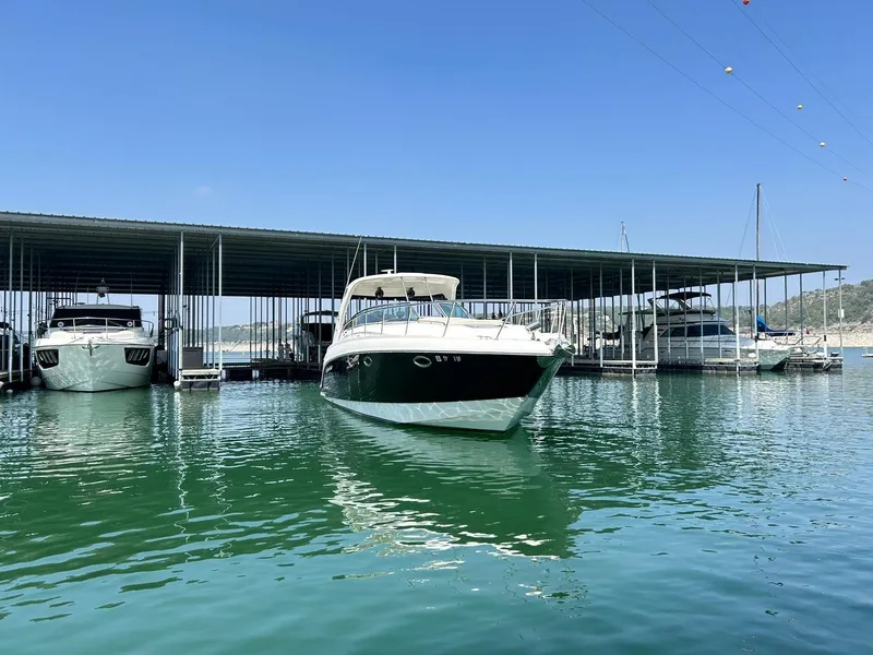 Slide: The Image of 2009 Chaparral 350 Signature boat docked in a marina under a clear blue sky. - 21