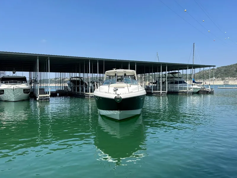 Slide: The Image of 2009 Chaparral 350 Signature boat docked in a marina under clear blue skies. - 22