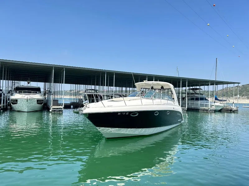 Slide: The Image of 2009 Chaparral 350 Signature boat docked in a marina under clear blue skies. - 23