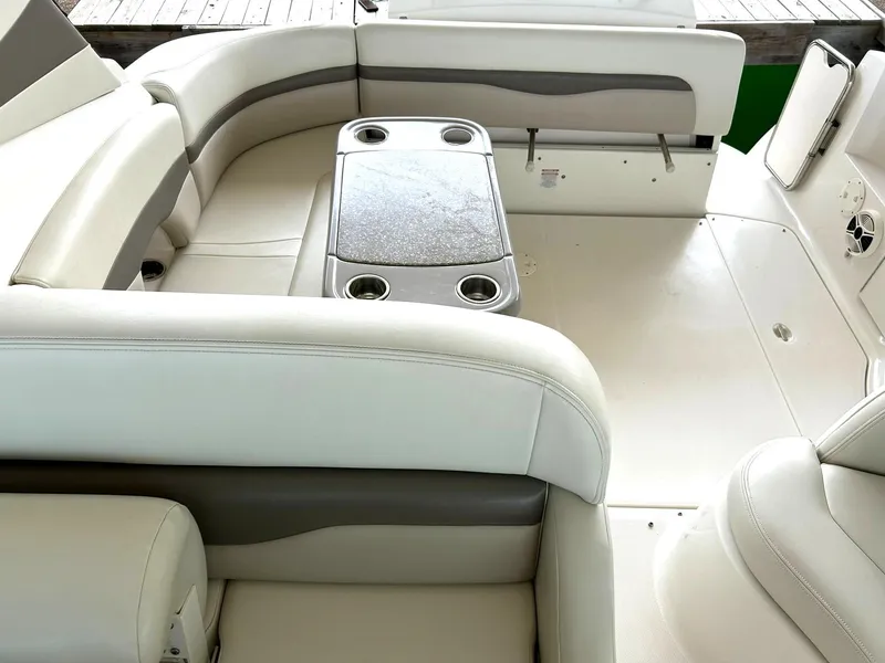 Slide: The Image of 2009 Chaparral 350 Signature boat interior with white seating and table. - 26