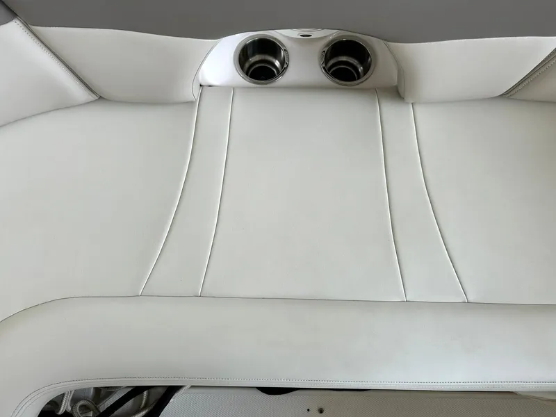 Slide: The Image of White leather seating on 2009 Chaparral 350 Signature boat with cup holders. - 30