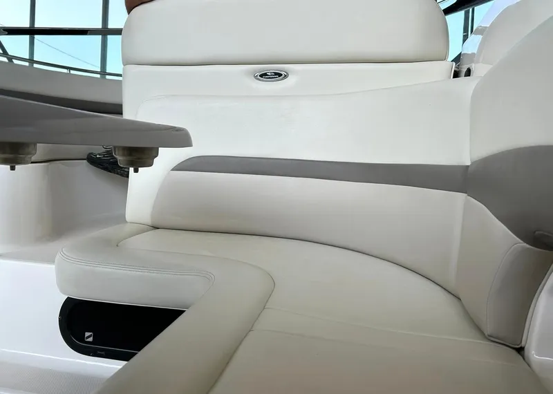 Slide: The Image of 2009 Chaparral 350 Signature boat interior with white leather seating and table. - 31