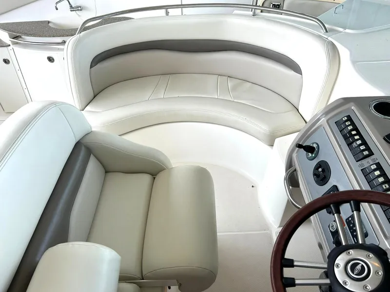 Slide: The Image of Interior of 2009 Chaparral 350 Signature boat with plush seating and modern helm. - 39