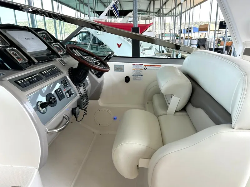 Slide: The Image of 2009 Chaparral 350 Signature boat cockpit with steering wheel and control panel. - 4