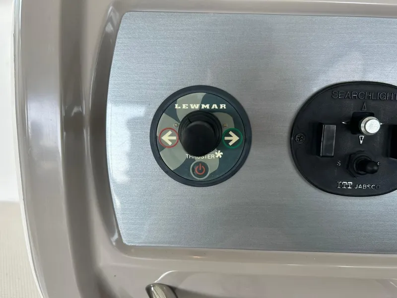 Slide: The Image of Control panel of a 2009 Chaparral 350 Signature boat featuring Lewmar thruster controls. - 44