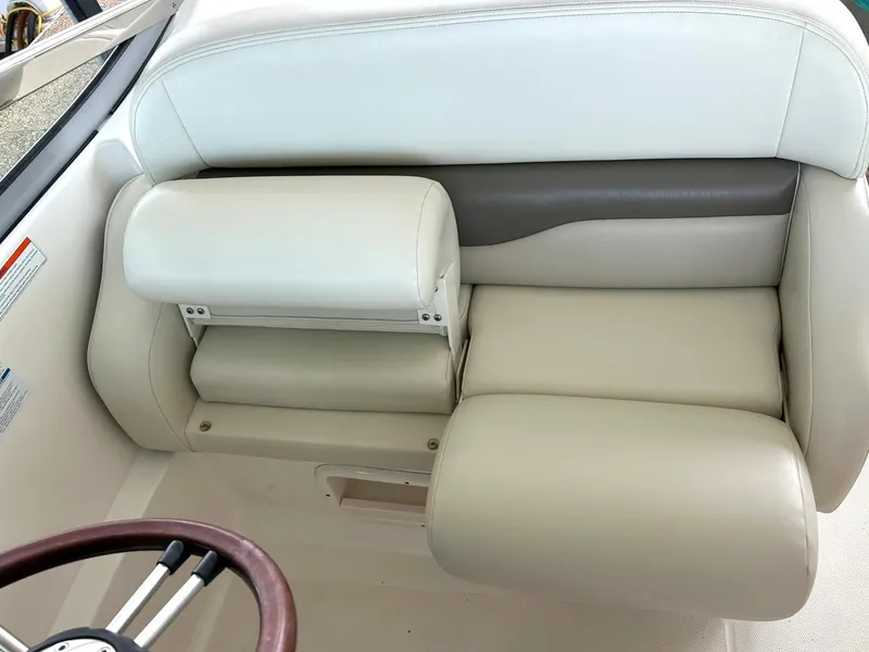 Slide: The Image of 2009 Chaparral 350 Signature boat interior with beige leather seating and steering wheel. - 47