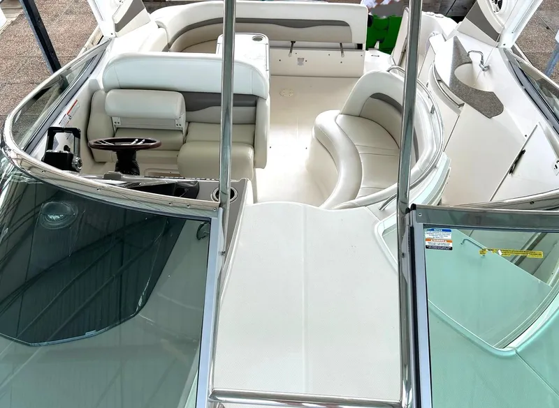 Slide: The Image of 2009 Chaparral 350 Signature boat interior with white seating and helm. - 49