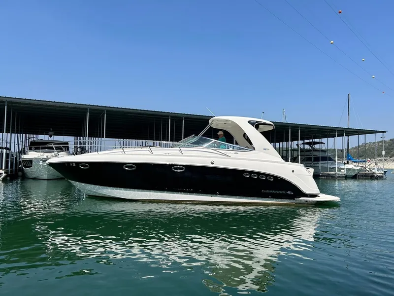 Slide: The Image of 2009 Chaparral 350 Signature boat docked in marina under clear blue sky. - 6