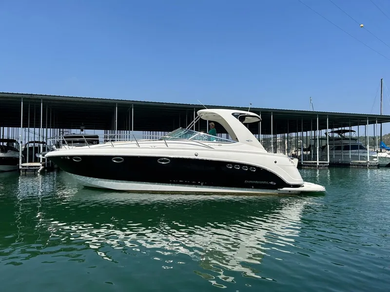Slide: The Image of 2009 Chaparral 350 Signature boat docked in marina, calm water reflection. - 7