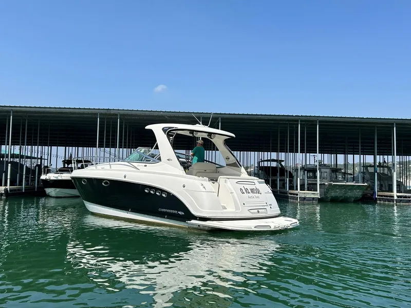 Slide: The Image of 2009 Chaparral 350 Signature boat docked in marina under clear blue sky. - 9