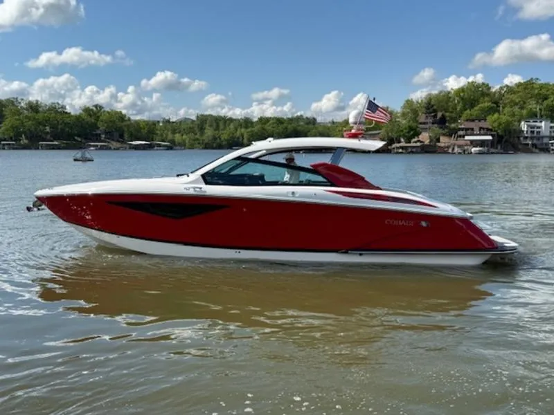 Slide: The Image of 2022 Cobalt A36BR boat on a lake under a clear blue sky. - 10