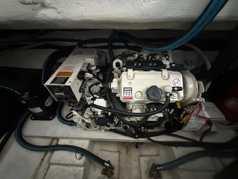 Slide: The Image of Engine compartment of a 2022 Cobalt A36BR boat, featuring a Westerbeke EFI engine. - 25