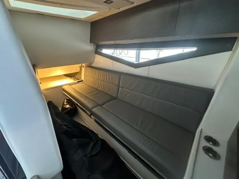 Slide: The Image of Interior of 2022 Cobalt A36BR boat with sleek gray seating and modern lighting. - 26